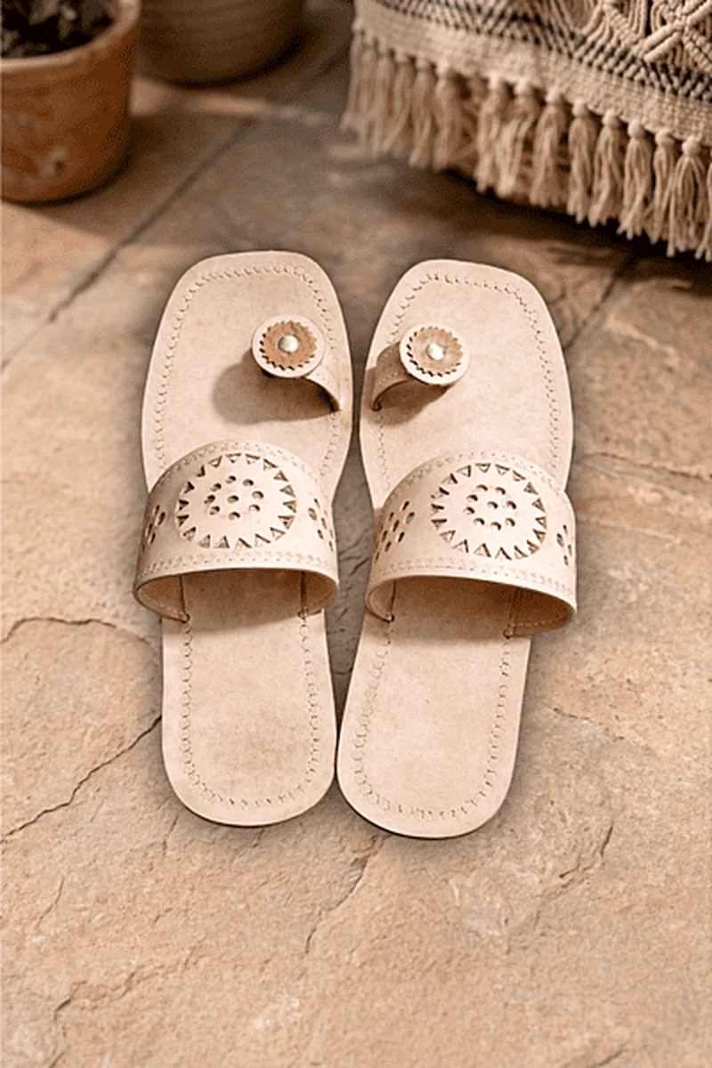 Minimal beige leather Chamba Chappal styled on a natural floor background